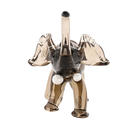 Glass elephant figurine on a white background