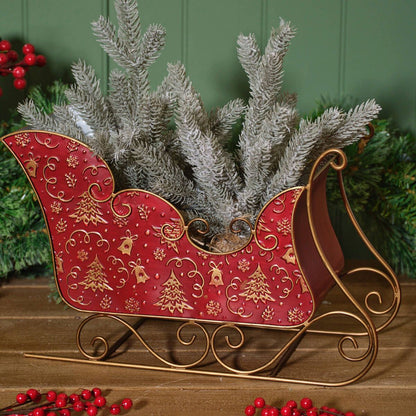 Red and gold metal Christmas sleigh decoration | Large festive ornament with embossed Christmas tree and snowflake pattern | Seasonal display UK
