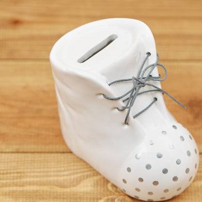 White ceramic baby boot money box or piggy bank | Decorative nursery saving pot with grey polka dots and laces | New baby gift UK