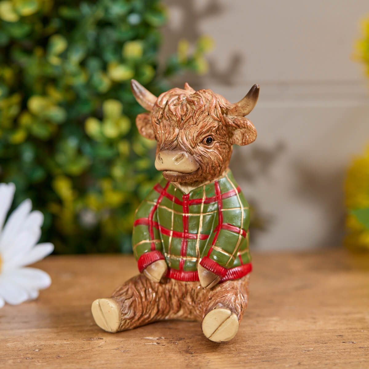 Highland Cow Sitting Figure | Resin decoration wearing a green and red tartan/plaid Christmas jumper | UK seasonal animal ornament