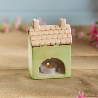 Light green ceramic miniature house tealight holder| Decorative cottage figurine with tan roof and floral detail | UK home or garden décor