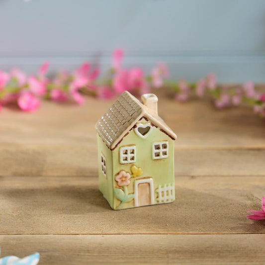 Light green ceramic miniature house ornament | Decorative cottage figurine with tan roof, heart window, and floral detail | UK home or garden décor