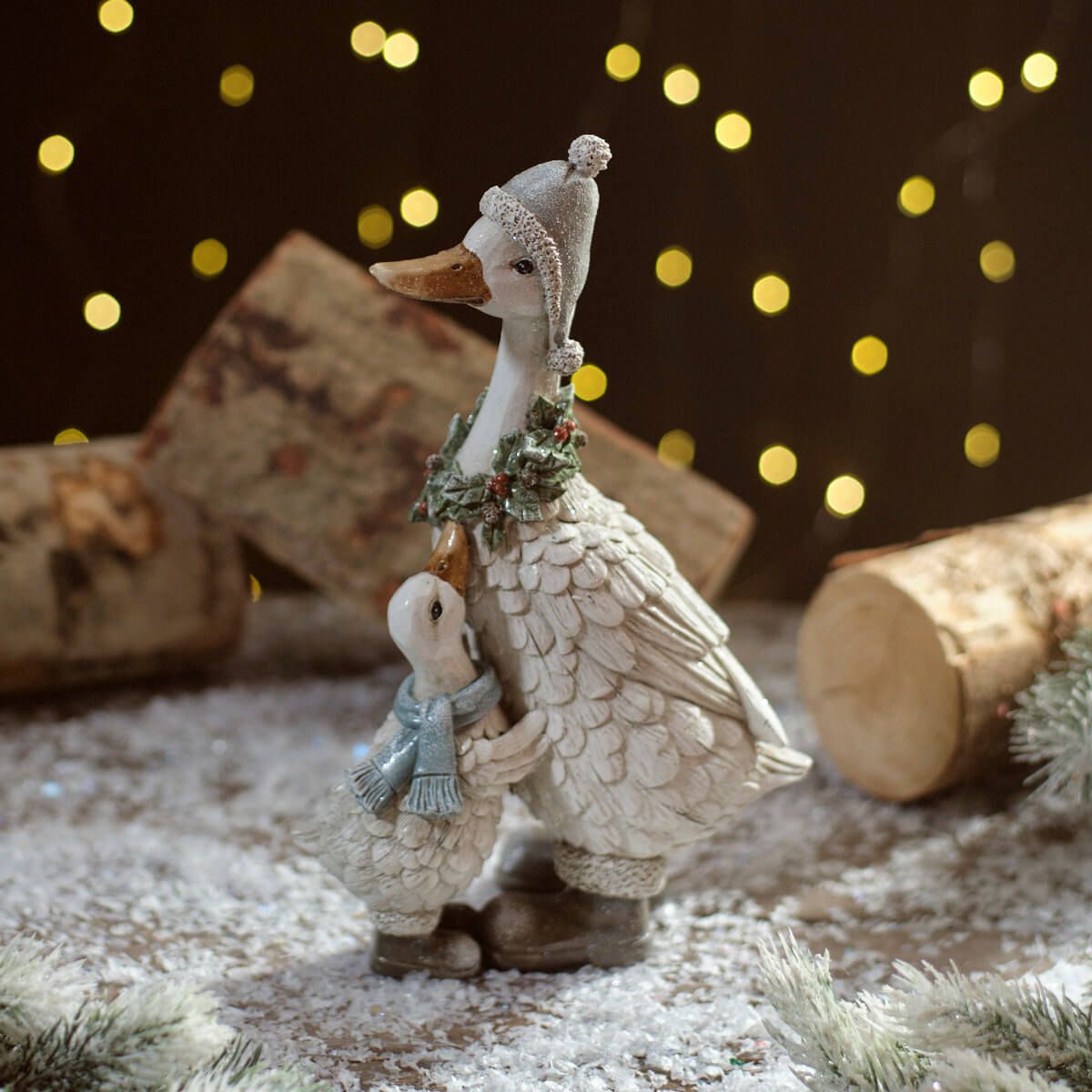 Christmas Goose and Gosling Figure | Resin decoration of an adult goose wearing a holly wreath and a gosling wearing a scarf and boots | UK seasonal animal ornament