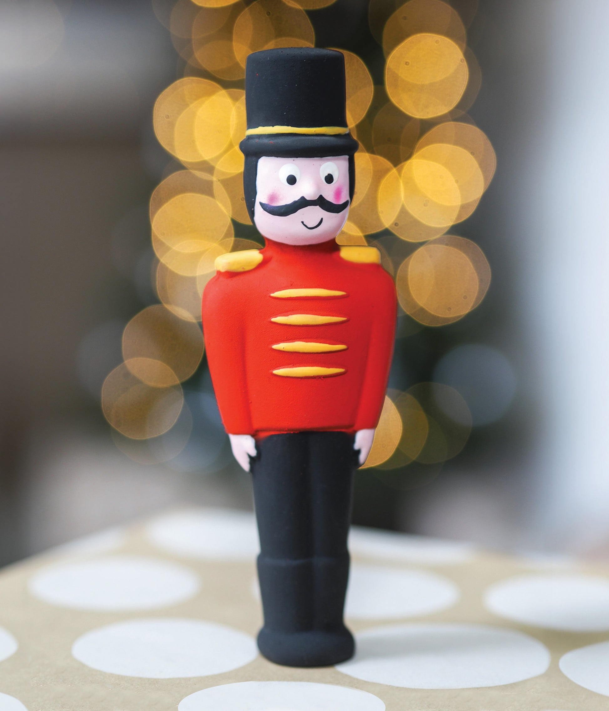 Toy soldier figurine with a blurred festive background