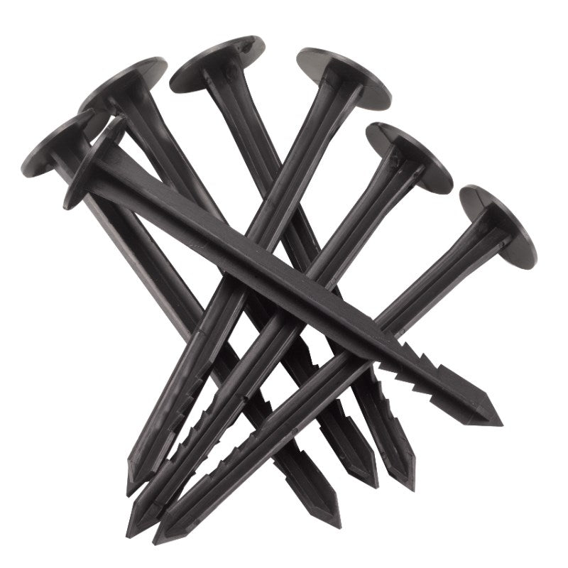 Black plastic stakes on a white background