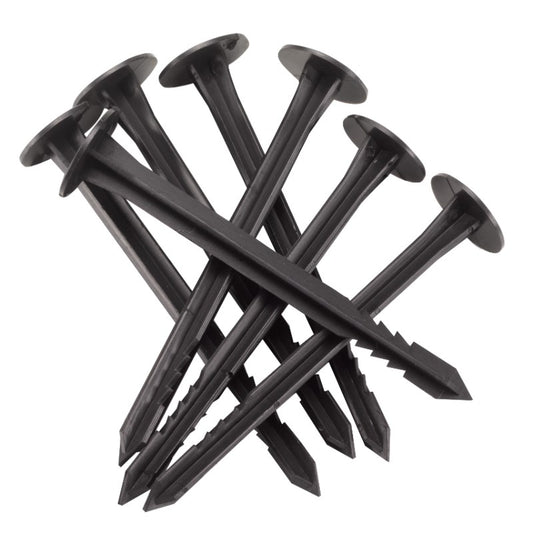 Black plastic stakes on a white background
