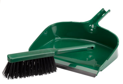 Green dustpan and brush set on a white background
