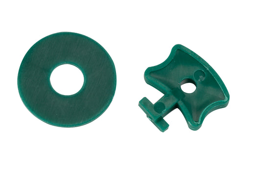 Two green plastic parts on a white background