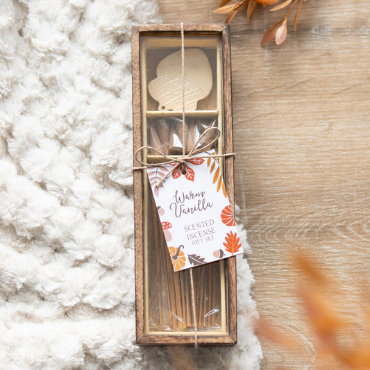 Scented incense set with wooden packaging on a textured surface