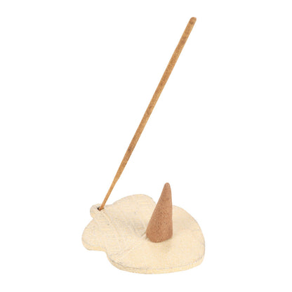 Unicorn-shaped incense holder with a single incense stick on a white background