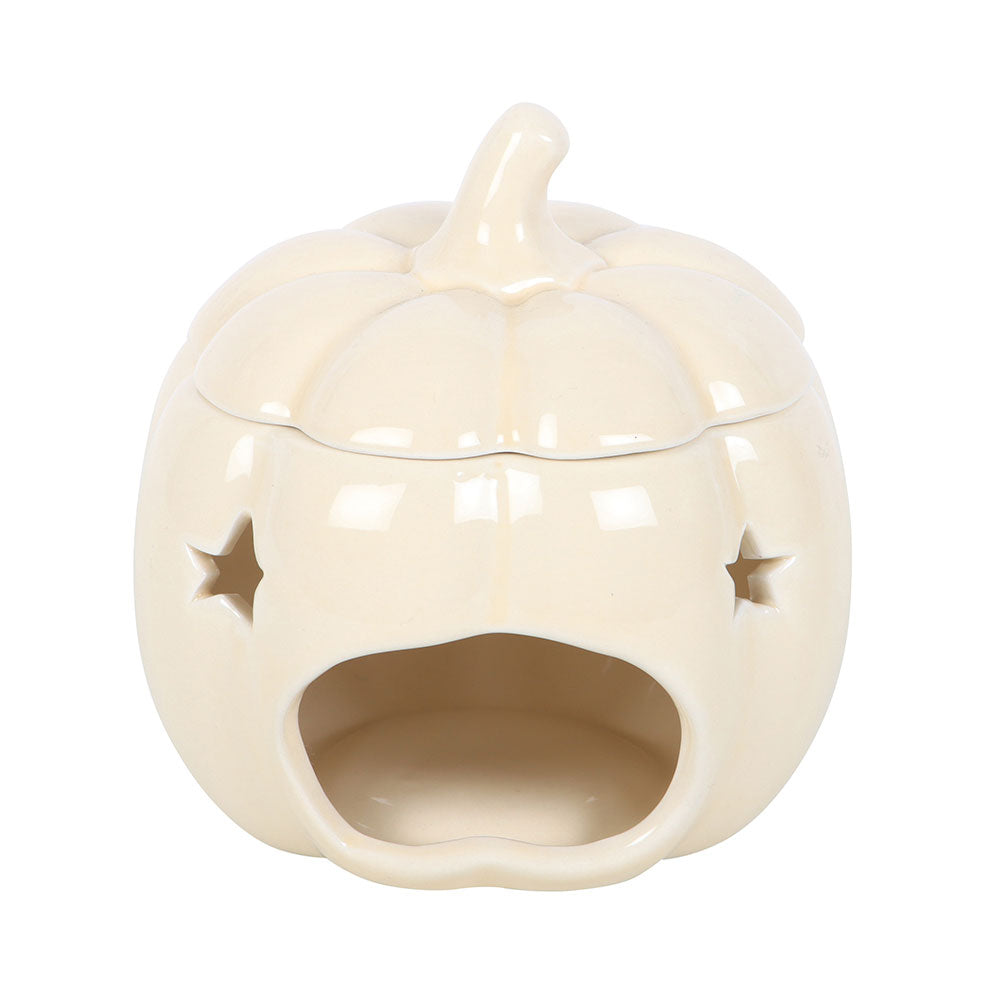 Ceramic pumpkin-shaped oil burner with star cutouts on a white background