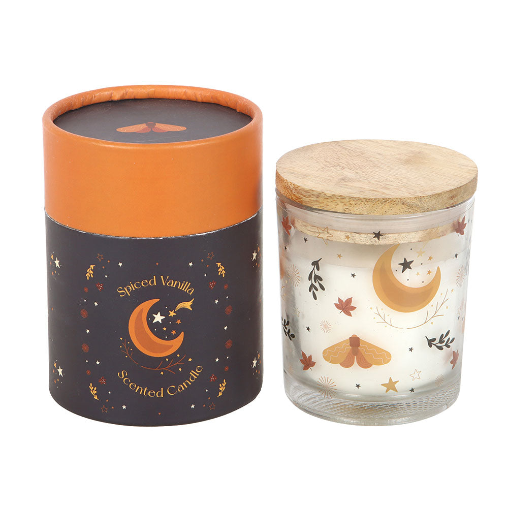 Two scented candles with decorative labels on a white background