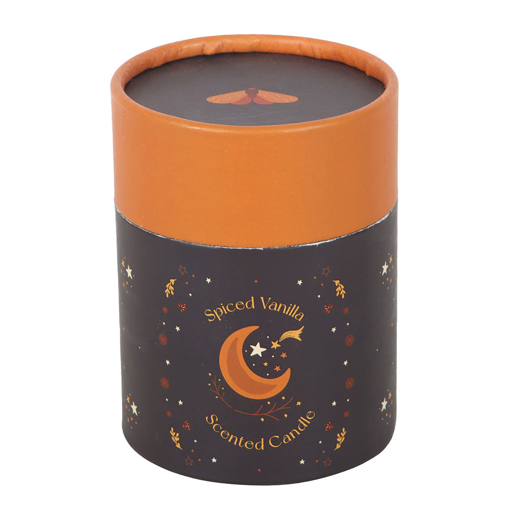 Spiced Vanilla scented candle in a decorative cylindrical container with orange lid on a white background