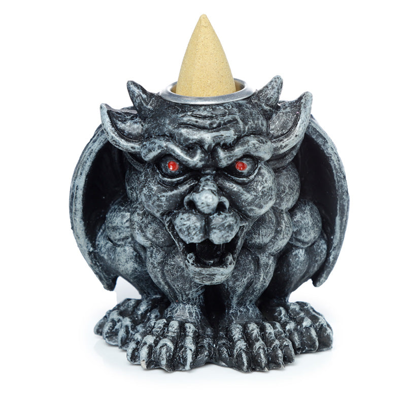 Gargoyle shaped incense burner on a white background