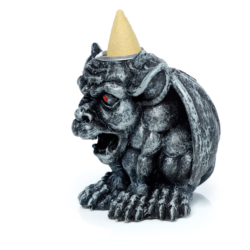 Gargoyle shaped incense burner on a white background