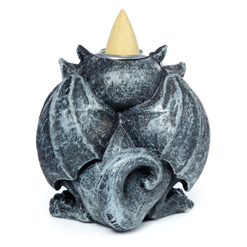 Gargoyle shaped incense burner on a white background
