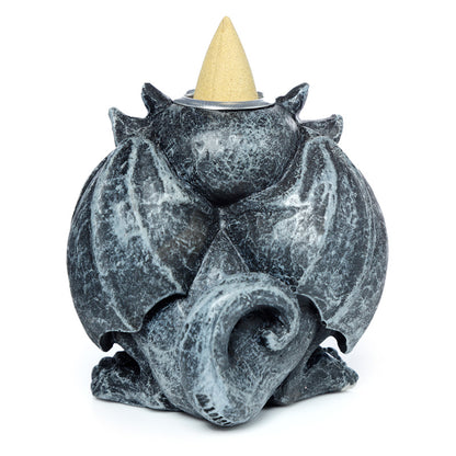 Gargoyle shaped incense burner on a white background