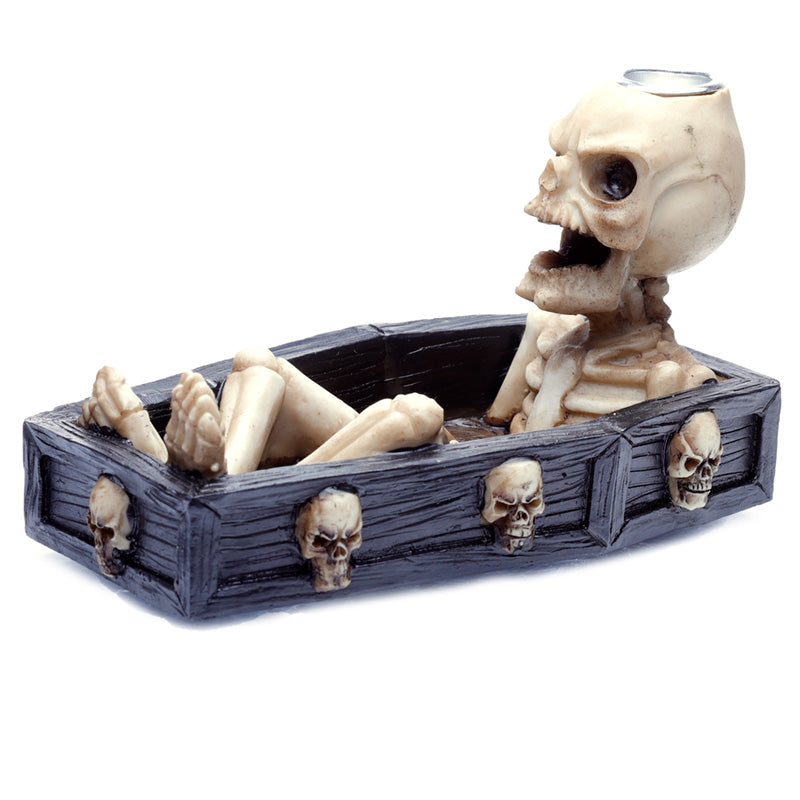 Decorative item with skeleton and coffin design on a white background
