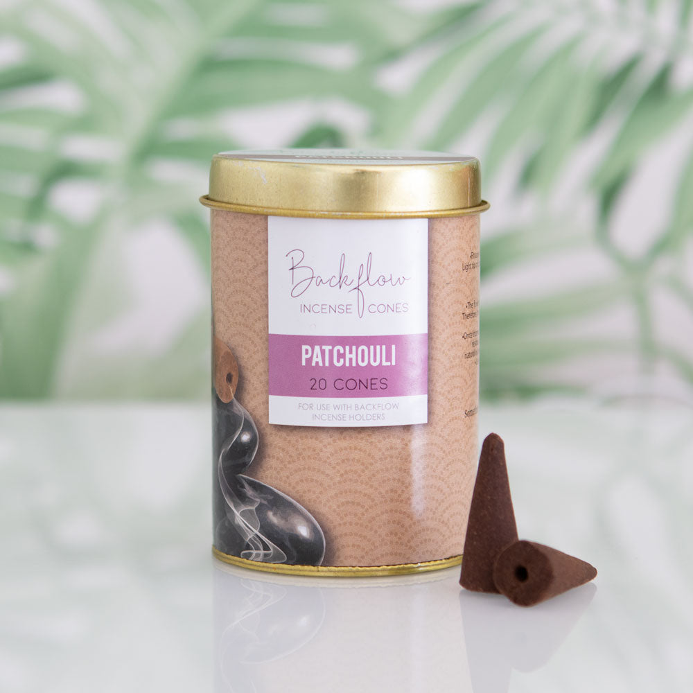 Backflow Incense Cone canister with patchouli cones on a light background