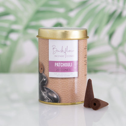 Backflow Incense Cone canister with patchouli cones on a light background