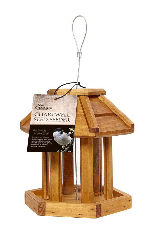 Wooden bird feeder with a label on a white background