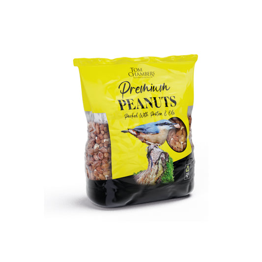 Bag of Tom Chambers Premium Peanuts with a green label on a white background