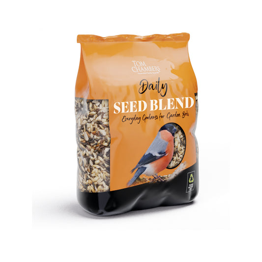 Bag of Tom Chambers Daily Seed Blend with a bird illustration on an orange background