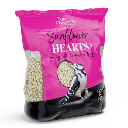 Bag of Tom Chambers Sunflower Hearts bird seed with a pink label and a picture of a bird on a white background.