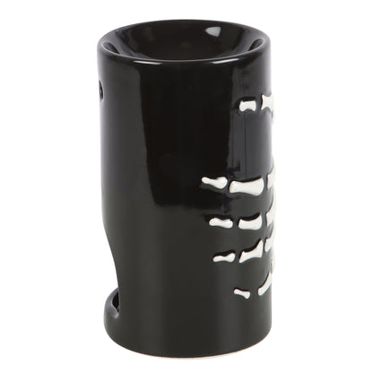 Black ceramic oil burner with bone design on a white background