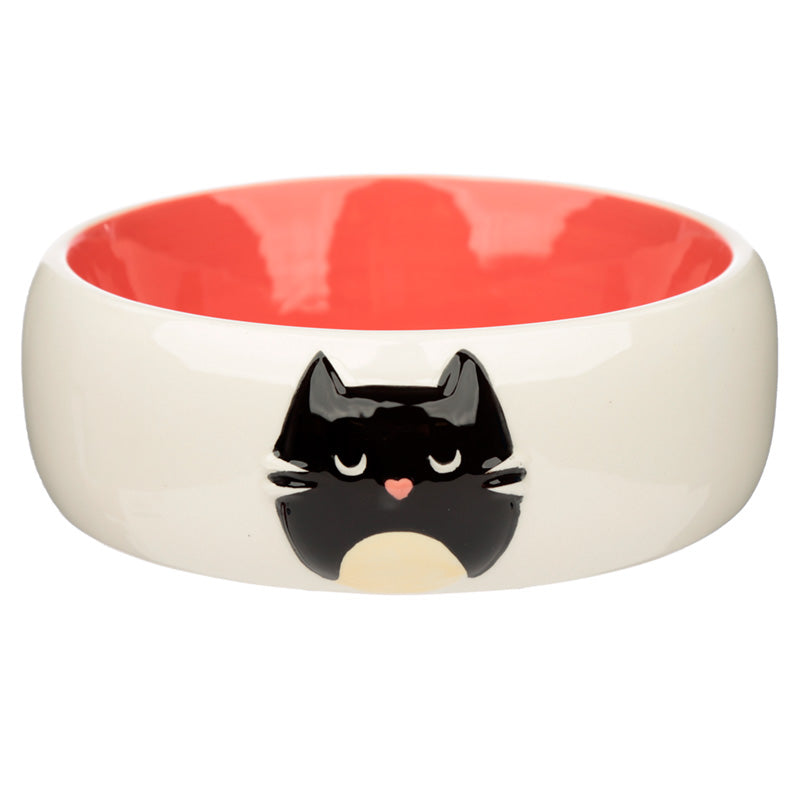 Ceramic bowl with a black cat face design on a white background