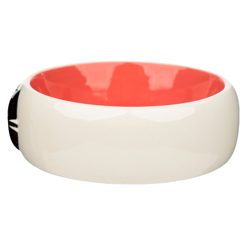 Ceramic bowl with red interior and white exterior on a white background