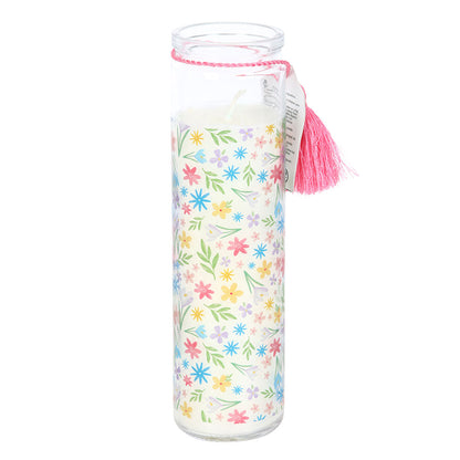 Clear glass jar with floral pattern and pink tassel on a white background