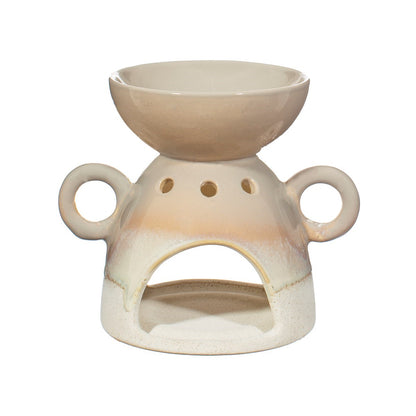 Ceramic oil burner with a beige color on a white background
