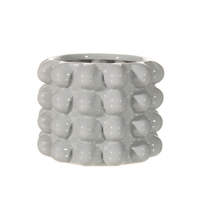Gray textured ceramic planter on a white background
