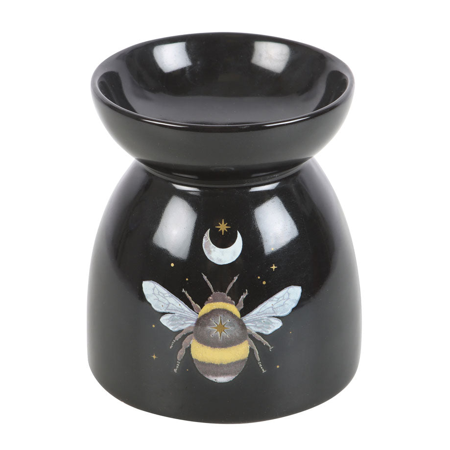 Black ceramic oil burner with bee design on a white background