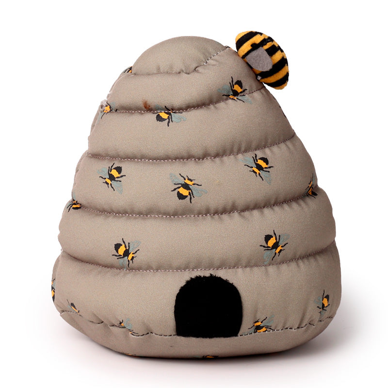 Plush toy shaped like a beehive with embroidered bees on a white background