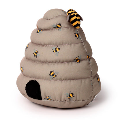 Toy bee hive with bees on a white background