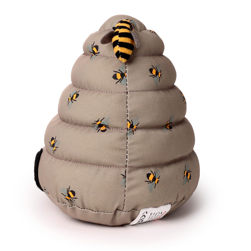 Toy beehive with bees on a white background