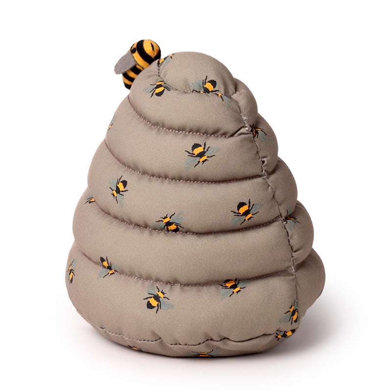 Toy beehive with bees on a white background