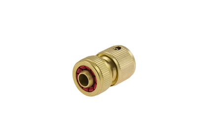 Brass fitting with red interior on a white background