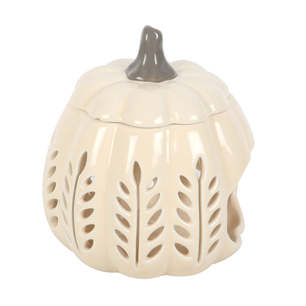 Ceramic pumpkin-shaped lantern with cut-out design on a white background