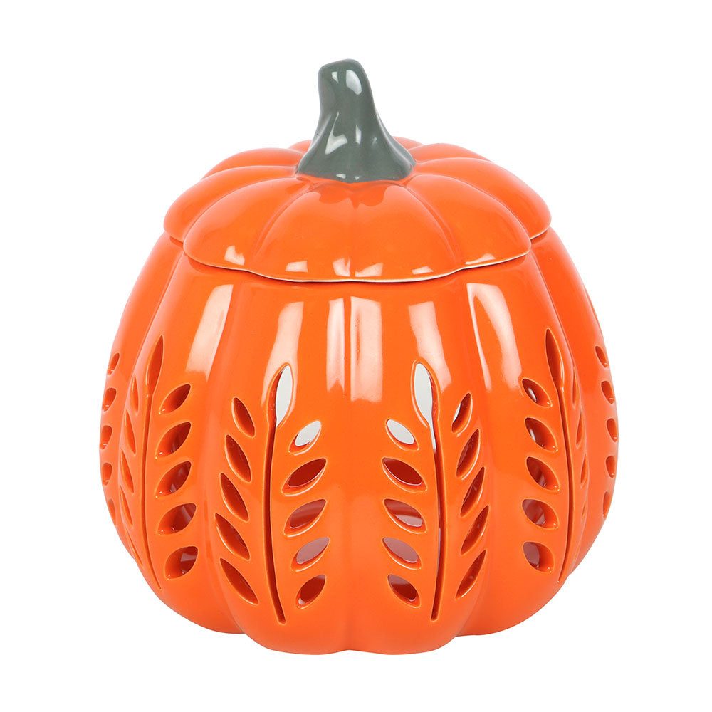 Orange pumpkin-shaped ceramic jar with a green lid on a white background