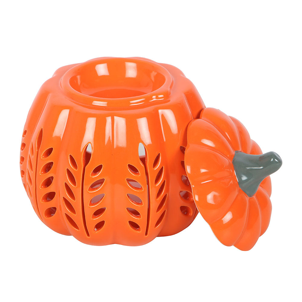 Orange ceramic pumpkin-shaped candle holder on a white background