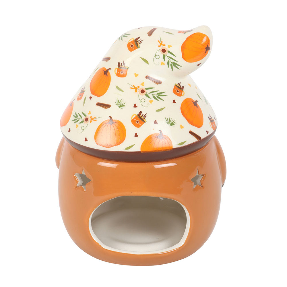 Ceramic oil burner with pumpkin design on lid against a white background