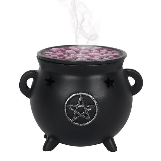 Black cauldron with a pentagram design containing pink incense balls on a white background