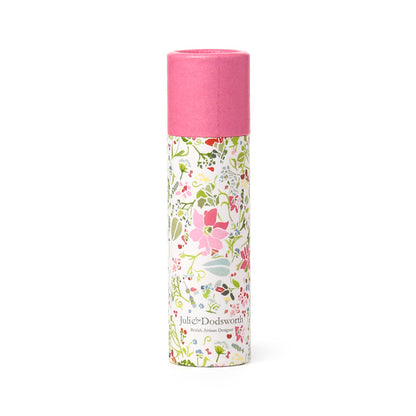 cylindrical product with floral design and pink top on a white background