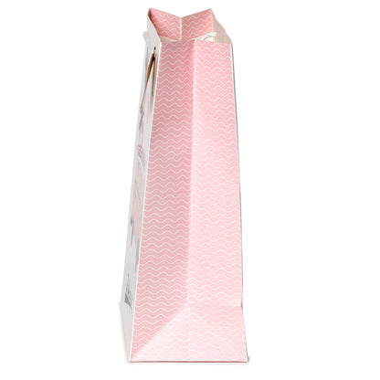 Pink paper bag with a white handle on a white background