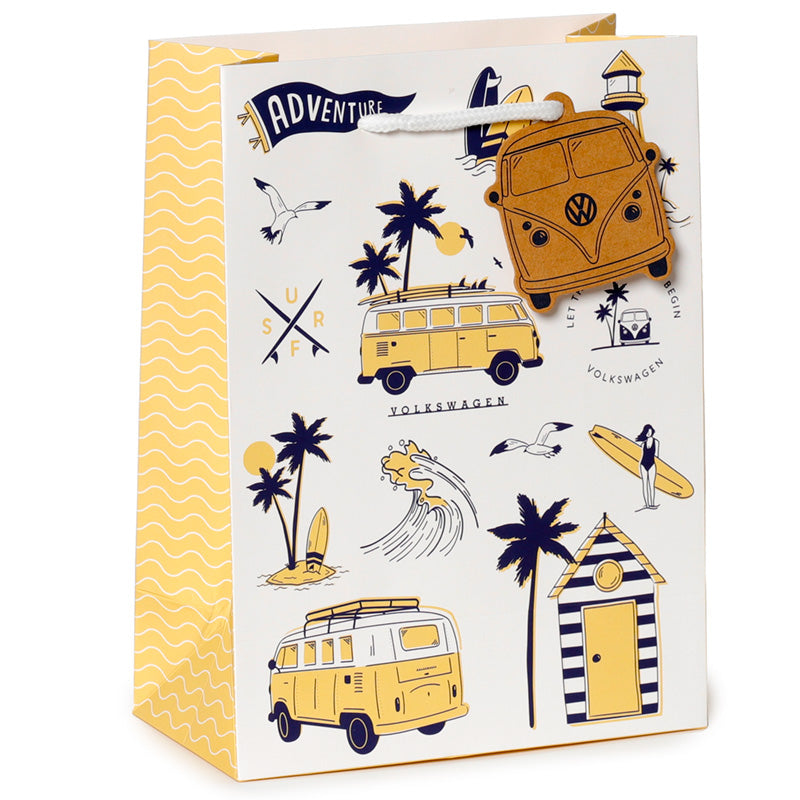 Gift bag with Volkswagen camper van design, palm trees, and beach elements on a white background.