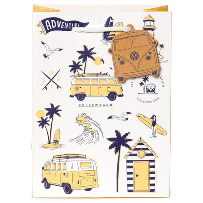 Gift bag with Volkswagen camper vans, palm trees, and beach elements on a white background