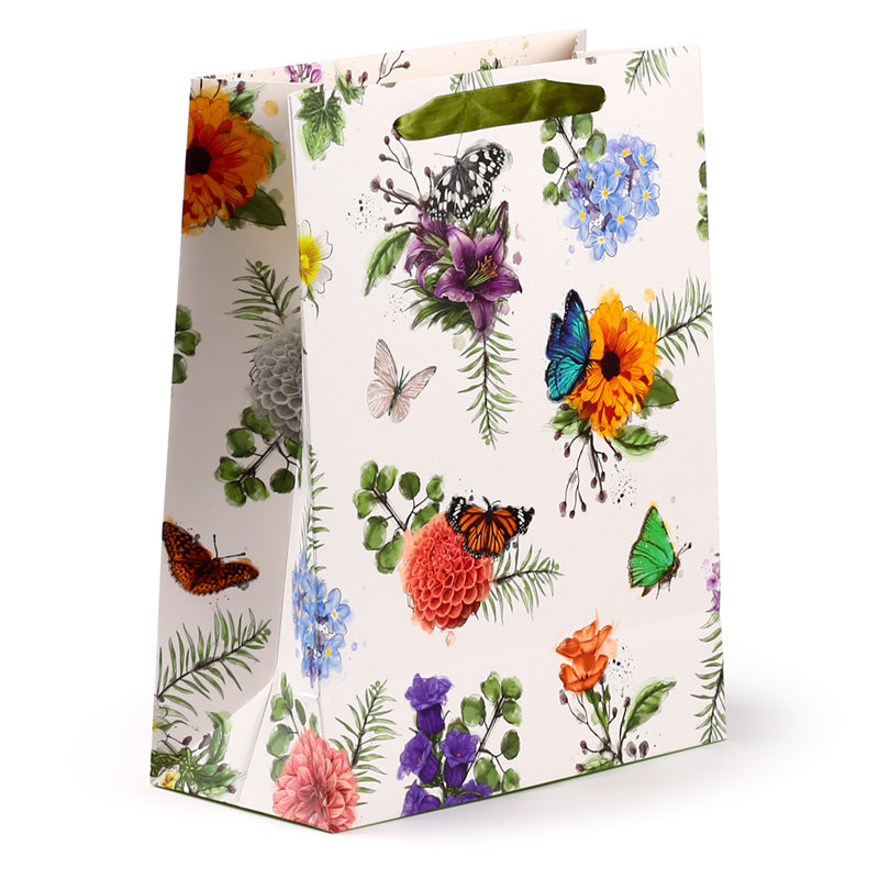 Gift bag with floral and butterfly design on a white background